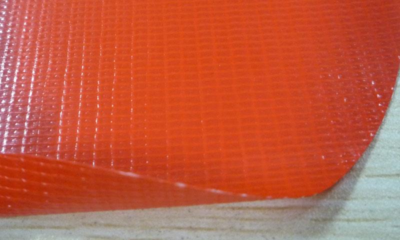 供应经编桔红色PVC夹网布（KQD-A-186）
